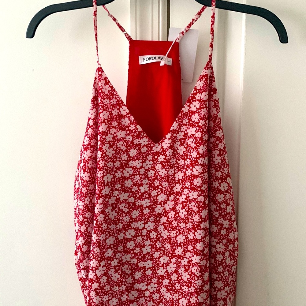 Women’s light weight racerback blouse. New with tag. Adjustable straps.